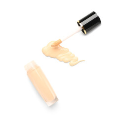 Bottle of makeup foundation and sample isolated on white background