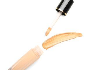 Bottle of makeup foundation and sample isolated on white background