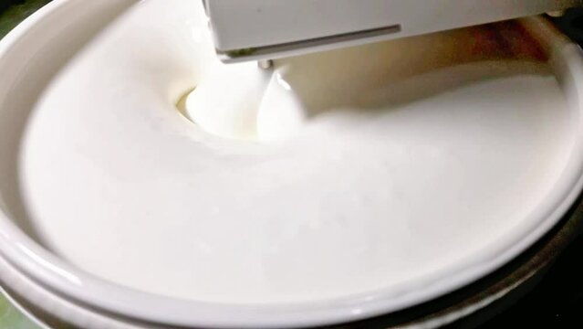 Mixing process of flour, milk and sugar using a mixer