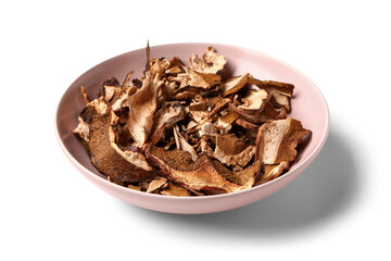 Pink bowl with tasty dried mushrooms on white background