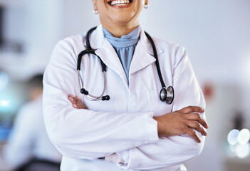 Doctor, arms crossed and stethoscope of a woman in a hospital for healthcare or cardiology. Closeup of a professional female medical worker ready for consultation, medicine and health check up