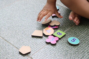Learning numbers, shapes and colors. Montessori type implement. wooden toys.