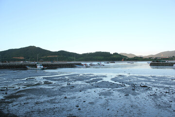 Beautiful sunset above the sea. The sunset of the mud flats. Sunset reflected in ocean mud flats