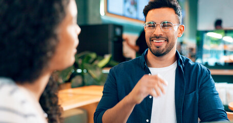 Happy man, glasses and smile on date in coffee shop for food, lunch or snack. Mexican person, laugh and funny joke with girlfriend in restaurant, bistro or cafe for bond, together and relationship