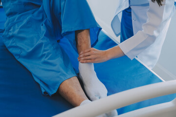 Patient doing some special exercises under supervision in a room.