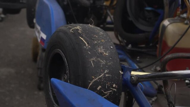 Preparing a racing kart car for the race. Spinning wheel close up