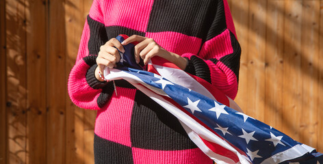 Caucasian young woman with a Us flag.