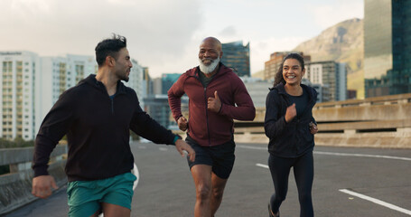 Runner group, friends and city on road with talking, progress and happy for fitness, health and wellness. Men, woman and conversation on metro street for workout, training and exercise in Cape Town - obrazy, fototapety, plakaty