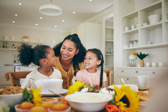 Happy, mother and children at table for breakfast, lunch and eating meal at home together. Family, morning and mom with girls in dining room with food for health, child development and nutrition