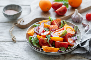 Green salad from leaves and tomatoes