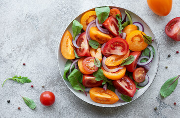 Green salad from leaves and tomatoes