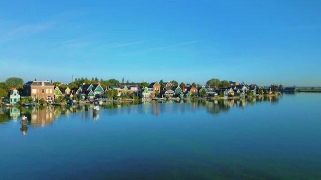 Beautifully built houses along the river at the Zaanse Schans, Koog aan de Zaan, Netherlands.