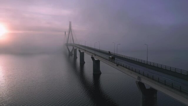 Car drives over bridge on the left side of the road, Heavenly Beautiful Morning Sunrise