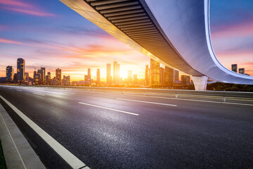 Fototapeta na wymiar Asphalt highway road and bridge with city skyline at sunset in Shenzhen, Guangdong Province, China.