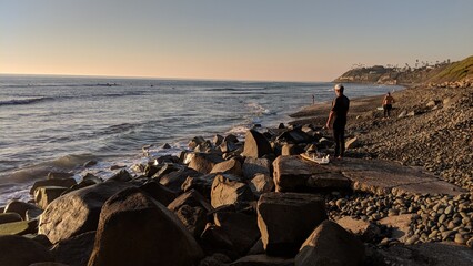 Southern California beach scenes with sunsets, surfers, tide pools and palms trees at Swamis Reef Surf Park and Moonlight Beach in Encinitas California.