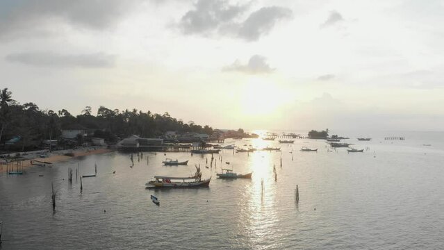 Side panning shot of Tanjung binga during sunset at Beliting, aerial