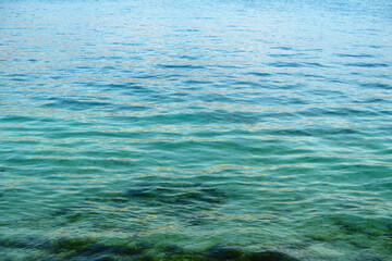The turquoise sea surface with slight water ripples