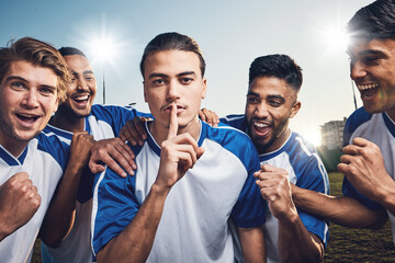 Soccer, team secret and portrait with group cheer outdoor on a field with emoji hand sign. Men, silence and confidential game plan with fitness, training and sport athlete with win celebration