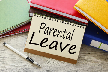 PARENTAL LEAVE text concept on sheet with notepad and calculator.Parental leave, maternity leave