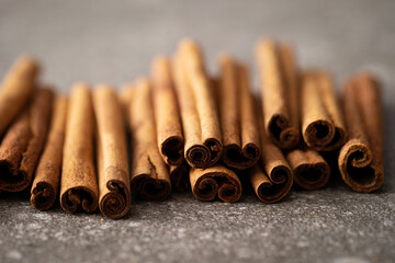 cinnamon sticks on a gray background
