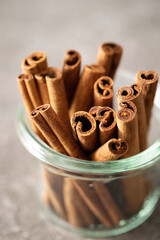 cinnamon sticks on a gray background