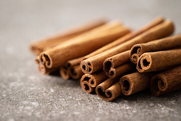 cinnamon sticks on a gray background