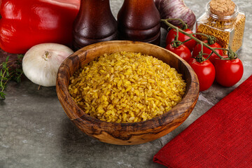 Dry wheat bulgur cereal heap