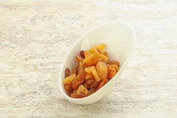 Sweet yellow raisin in the bowl
