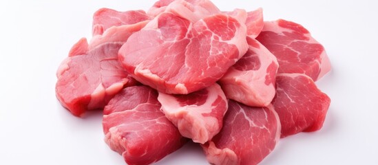 A white background showcases a raw heart from a pork that has been isolated