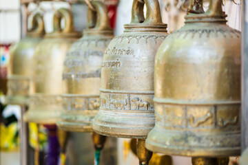 Fototapeta na wymiar buddhist bells at ancient buddhist temple, close-up with selective focus. zen, meditation, mindfulness concept