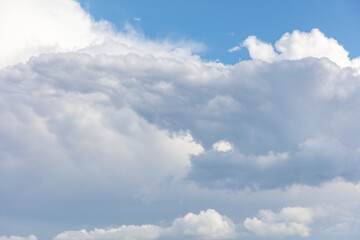 White clouds on a blue sky as a background