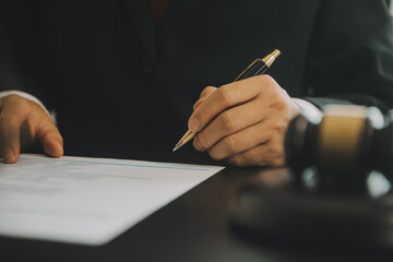 Business and lawyers discussing contract papers with brass scale on desk in office. Law, legal...