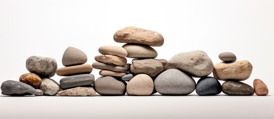 Multiple granite stones arranged in a stack separated from the white background
