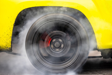 Drag car burning tire, Warm up tire before competition, Drag car wheel, Spinning wheel and smoke,...