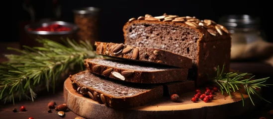 Foto op Plexiglas Rye bread slices baked with sunflower seeds are black in color © AkuAku