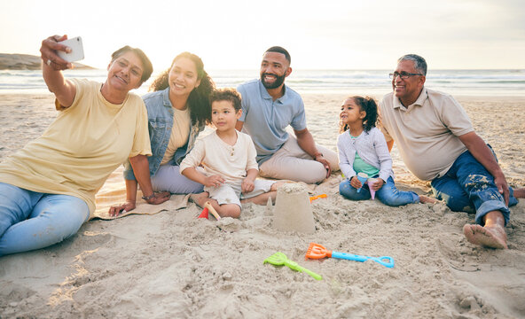 Family, generations and selfie on the beach, travel and tropical vacation with memory and social media post. People outdoor, grandparents and parents with young kids, adventure and smile in picture