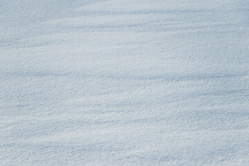 Snow texture. White surface of snow with clearly defined texture - obrazy, fototapety, plakaty