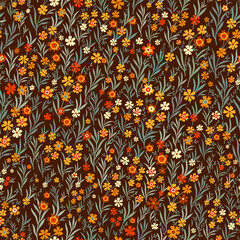 Vector floral seamless pattern. Seamless pattern in yellow and orange tones on a dark background. Floral pattern in autumn style.