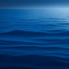 Obraz premium Ocean landscape. Silhouette concept. Close-up minimal image of waves in dark blue lake water.