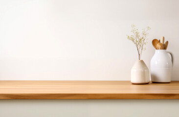 Wooden shelf with white vase plant, wooden kitchen utensils and white wall background. High quality photo