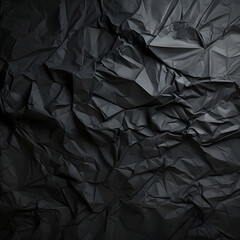Black wrinkled paper texture. Black crumpled paper texture with folds, black background, wallpaper.