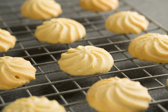 Closeup image homemade butter cookies put on wire.