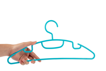 Plastic clothes hanger in hand isolated on transparent background
