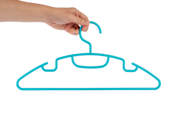 Plastic clothes hanger in hand isolated on transparent background