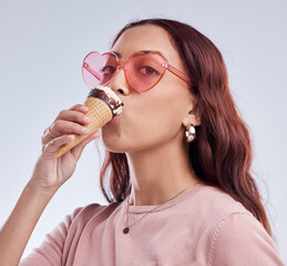 Eating, ice cream and portrait of woman with sunglasses in studio with dessert, snack and sweet treats. Fashion, food and face of female person with cone in trendy accessories, style and cosmetics