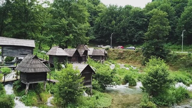 Watermills on small river near Jajce, Bosnia, streams and bridges, greenery, drone aerial