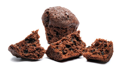 Whole and broken into pieces chocolate muffin isolated on a white background. Chocolate chip muffin.