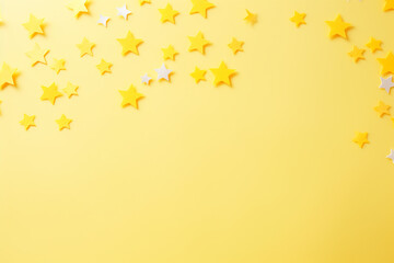 Abstract background with yellow stars on yellow paper
