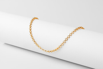 Golden chain on paper background studio shot © fotofabrika