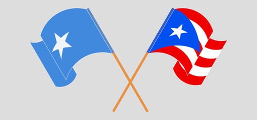 Crossed and waving flags of Somalia and Puerto Rico